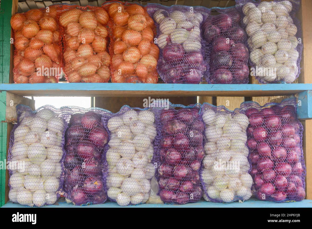 Many Red Onions in Purple Mesh Bags Stock Photo - Image of shop, bags:  278053590