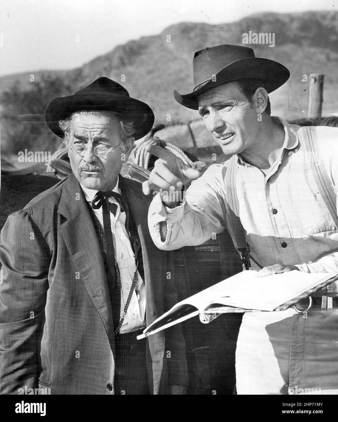 Photo of Milburn Stone (Doc Adams) and Dennis Weaver (Chester Goode) from the television program Gunsmoke Stock Photo
