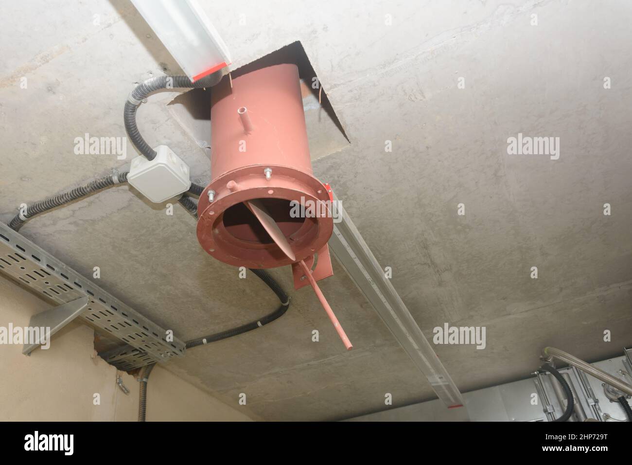 Pipe in ceiling of the room. Forced exhaust ventilation in industry. Close-up, selective focus. Stock Photo