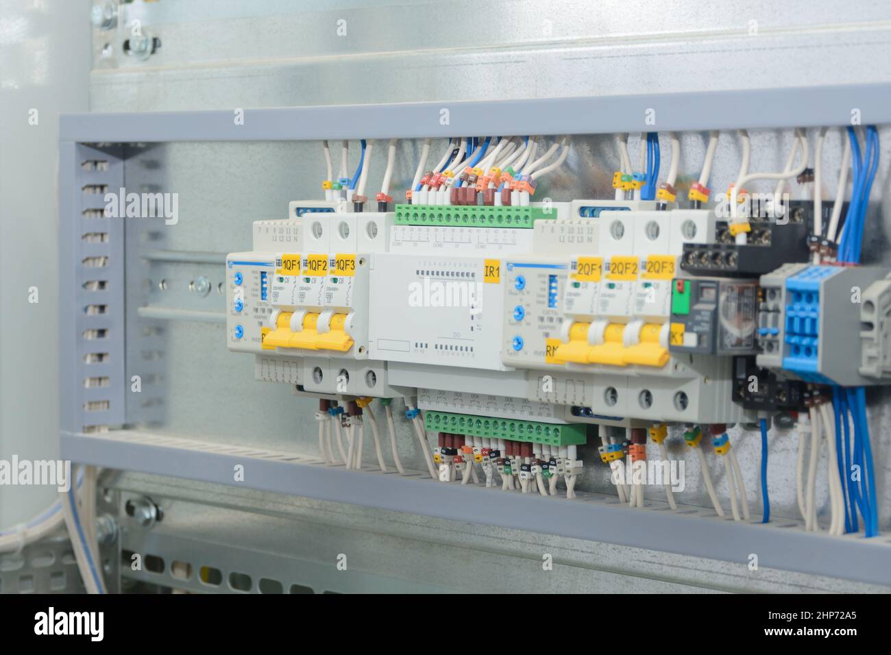 Programmable logic controller, automatic input of power reserve in the electrical cabinet. Close-up, selective focus. Stock Photo