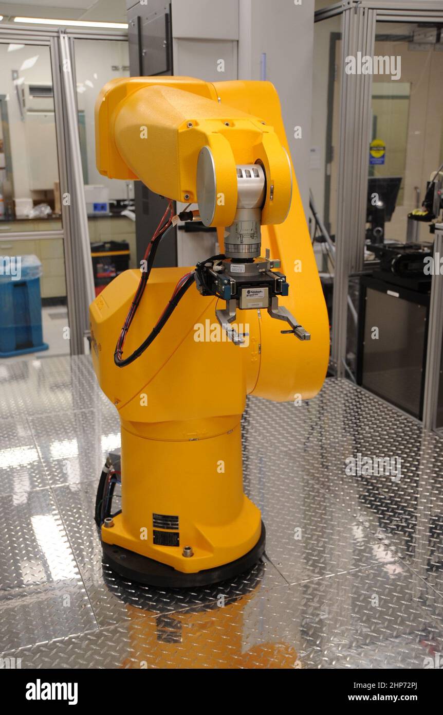 Shown is one of three robotic arms on the Kalypsys robotic system that enables ultra high-throughput screening of small molecules against diverse types of assays. The arms grip microtiter plates and move them among the various stations of the robot. ca.  August 28 2009 Stock Photo