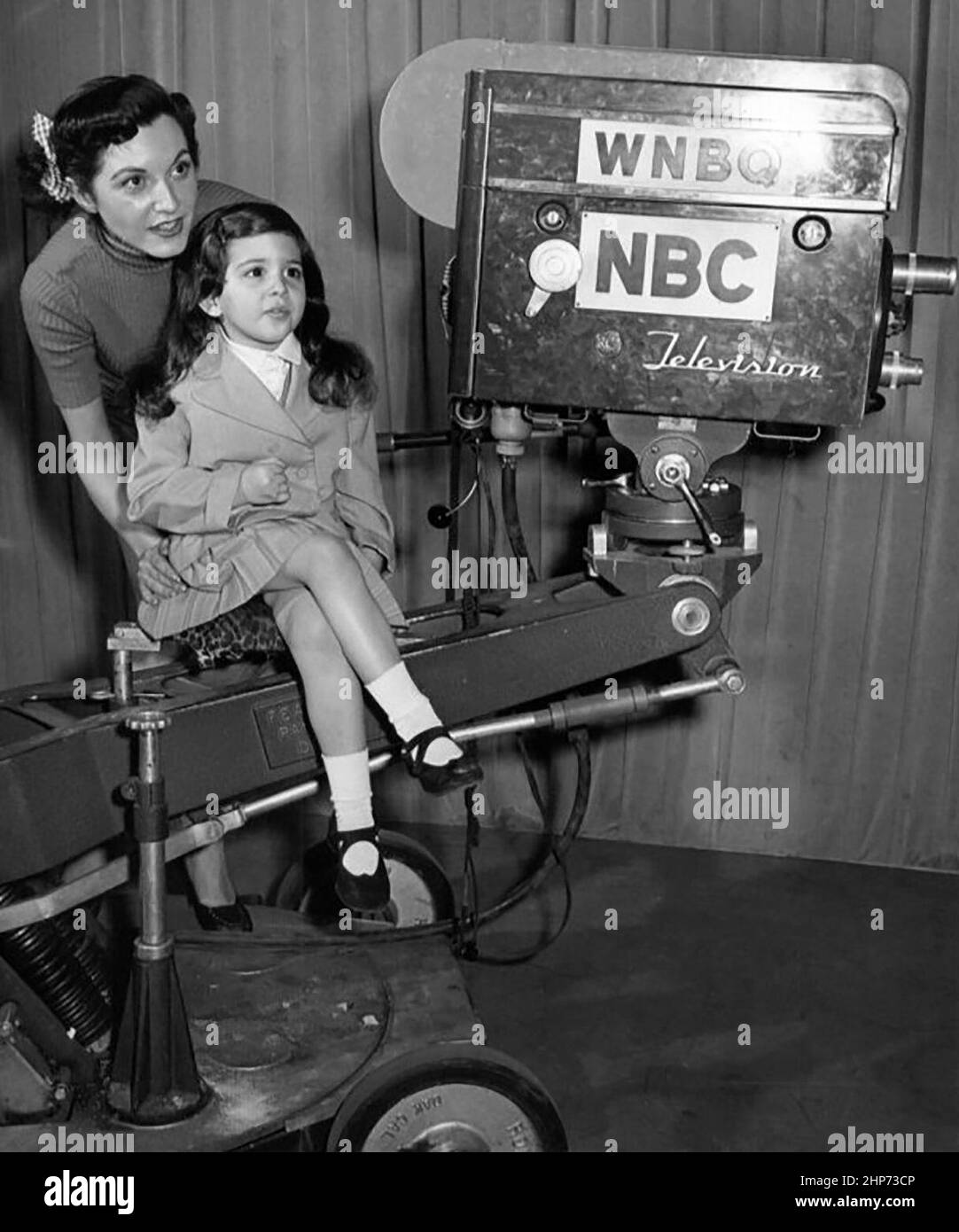 Photo of a television camera used in 1951.  The television station was known as WNBQ at the time, but has been WMAQ-TV (Chicago) for many years. Actress-singer Connie Russell and her daughter, Austine, are pictured. Stock Photo