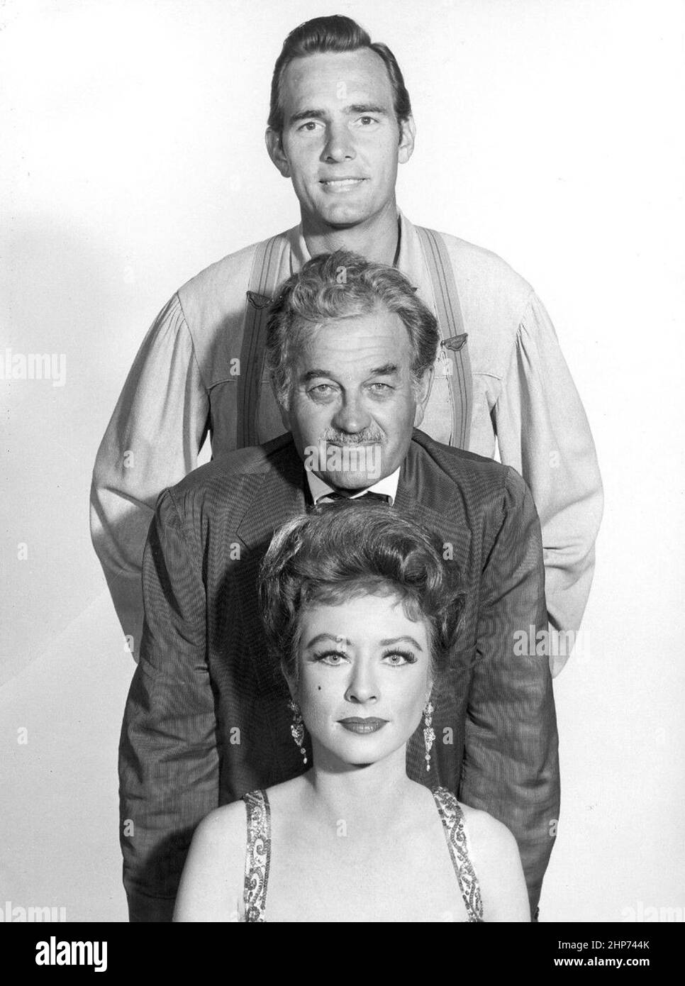 Photo of the supporting cast of Gunsmoke in 1960.  From top-Dennis Weaver (Chester Goode), Milburn Stone (Doc Adams) and Amanda Blake (Miss Kitty Russell) Stock Photo