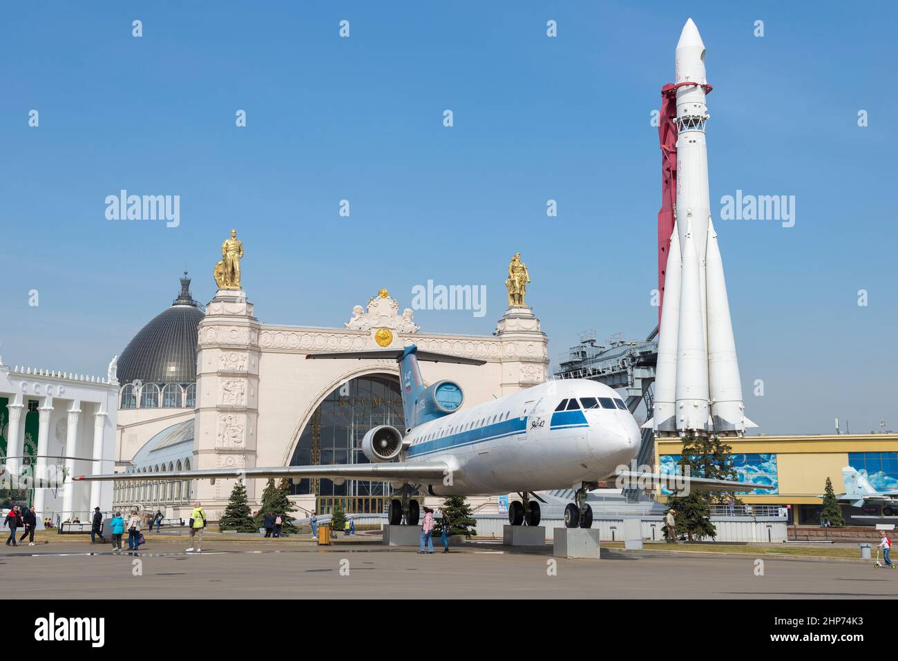 MOSCOW, RUSSIA - APRIL 14, 2020: Yak-42 aircraft and Vostok space rocket on the territory of the All-Russian Exhibition Center (VDNH) on April sunny d Stock Photo