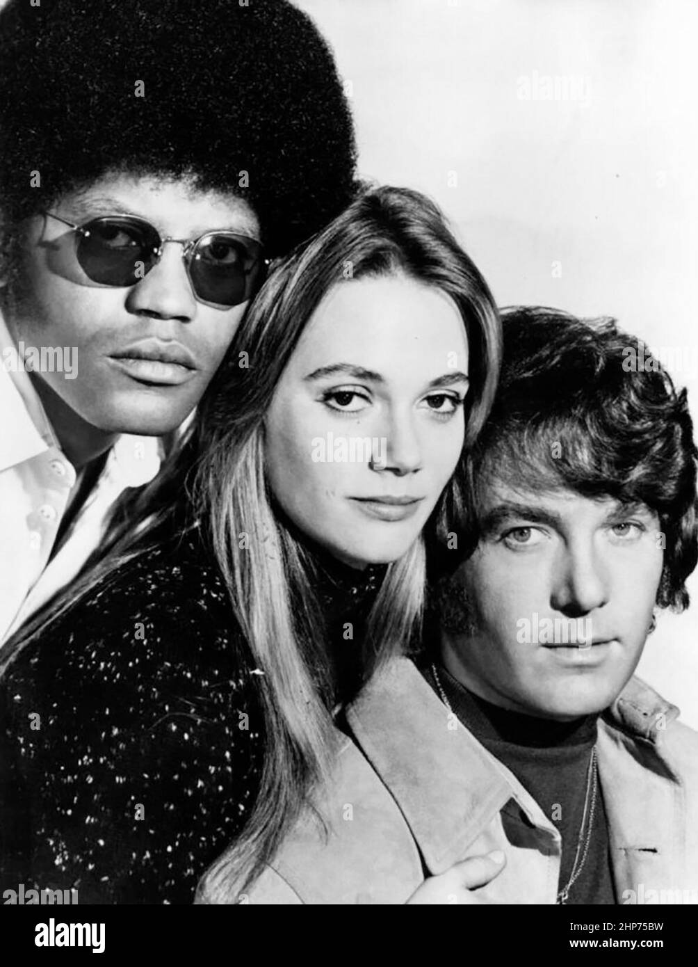 Publicity photo from the television program The Mod Squad.  The main cast is pictured, from left: Clarence Williams III, Peggy Lipton and Michael Cole Stock Photo
