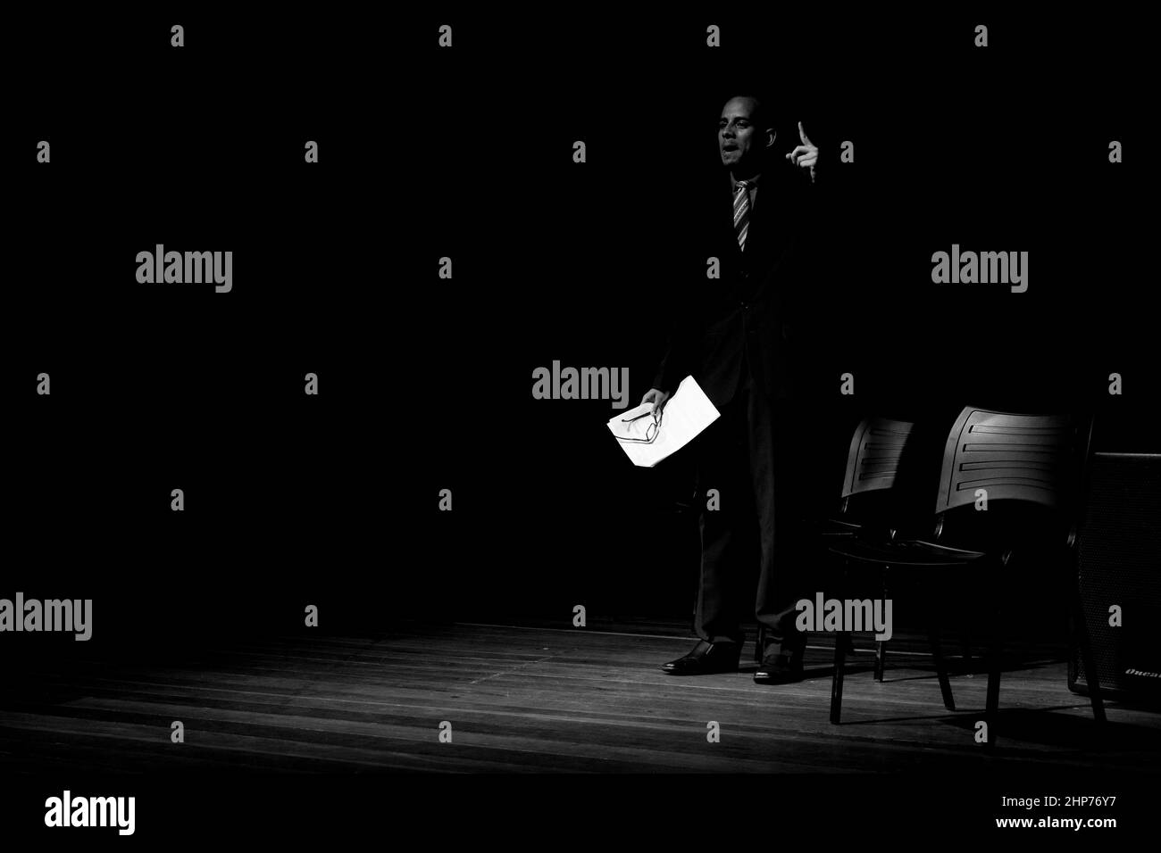 Actor on stage represents a dramatic character. Scene in a theater in the city of Salvador, Brazil. Stock Photo