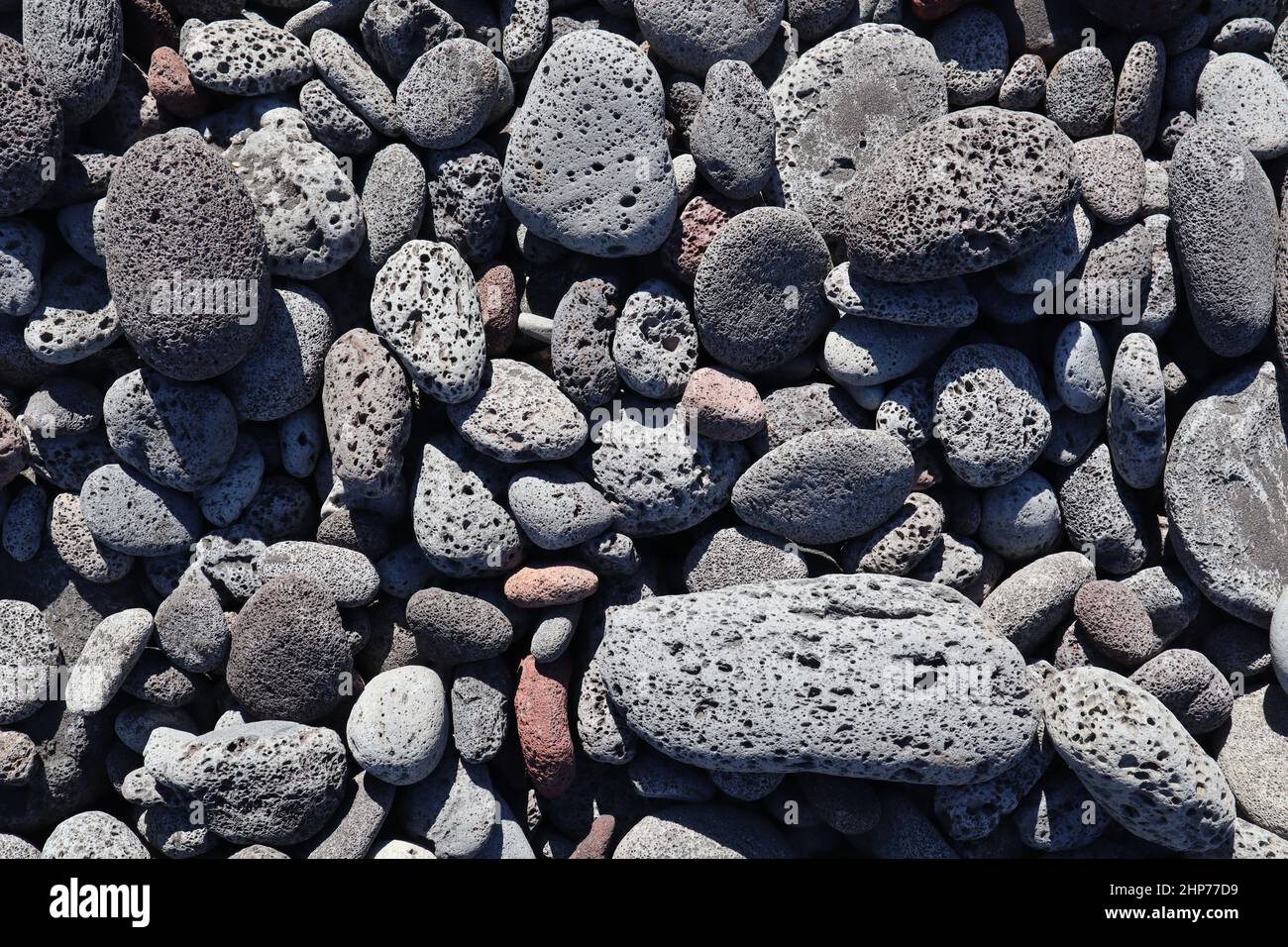 Top view of rounded lava rocks on the beach of Kona, Hawaii, great for ...