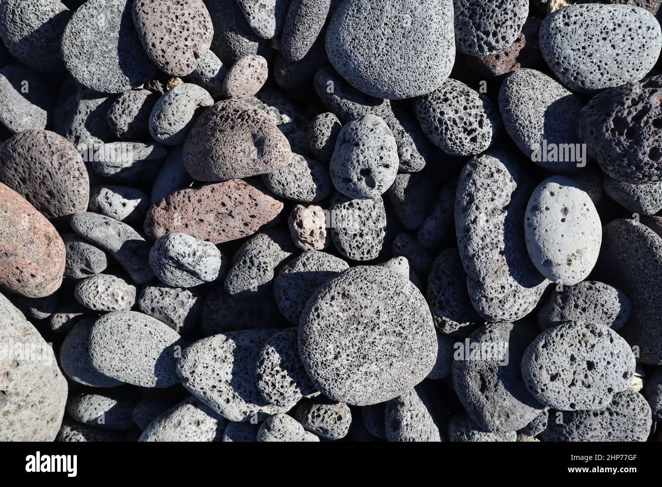 Vertical shot of rounded lava rocks on the beach of Kona, Hawaii, great ...