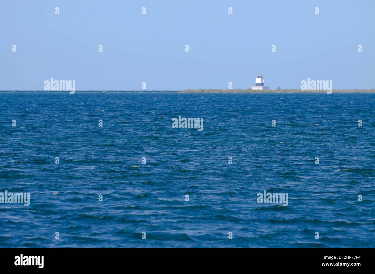 Poe Reef Lighthouse in the distance on Lake Huron. Stock Photo