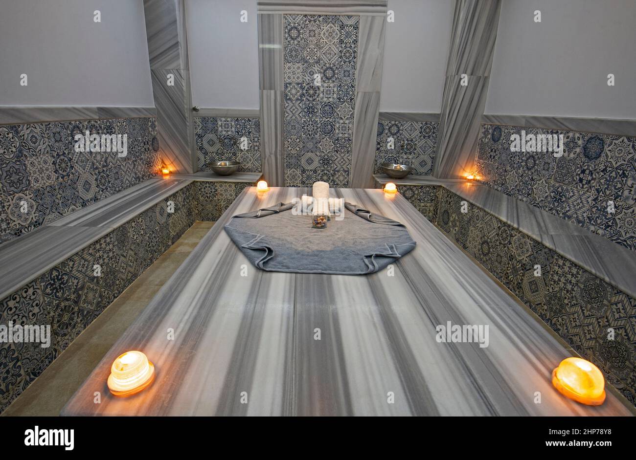 Interior design of turkish baths in luxury health spa with massage table and candles Stock Photo