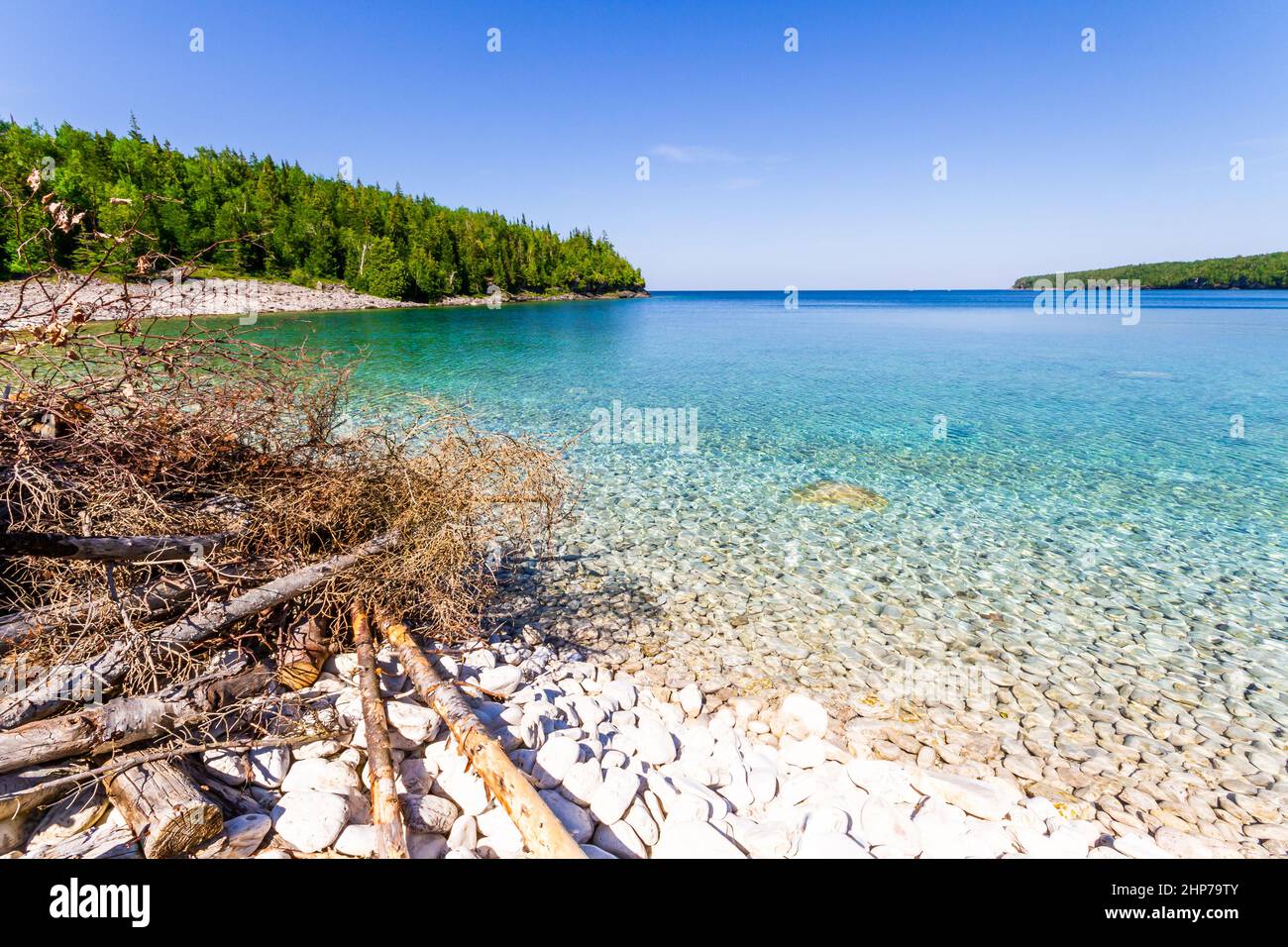 White, stony coastline lake Huron. Crystal clear water shows limestone