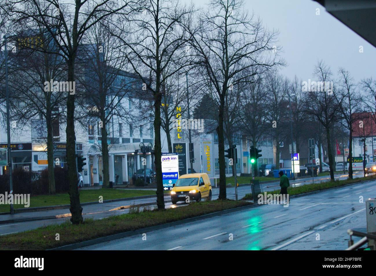 Göttingen, Germany. 19th Feb 2022. A young man crosses the road during a storm called 'Yelenia' in Göttingen. Hurricane Yelenia has affected people's lives. Because of the storm Deutsche Bahn has stopped long-distance traffic in several federal states. In Lower Saxony, Bremen, Hamburg, Schleswig-Holstein, Mecklenburg-Western Pomerania, Berlin and Brandenburg, there are no long-distance trains, as the railway announced on Thursday. There are also effects in other states. (Photo by Tubal Sapkota/Pacific Press) Credit: Pacific Press Media Production Corp./Alamy Live News Credit: Pacific Press Med Stock Photo