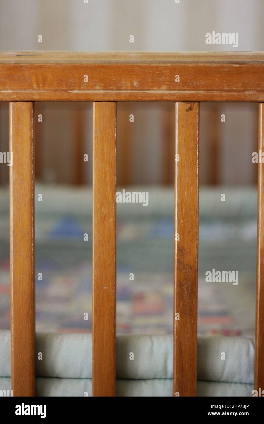 The vertical slats on a vintage baby crib Stock Photo Alamy
