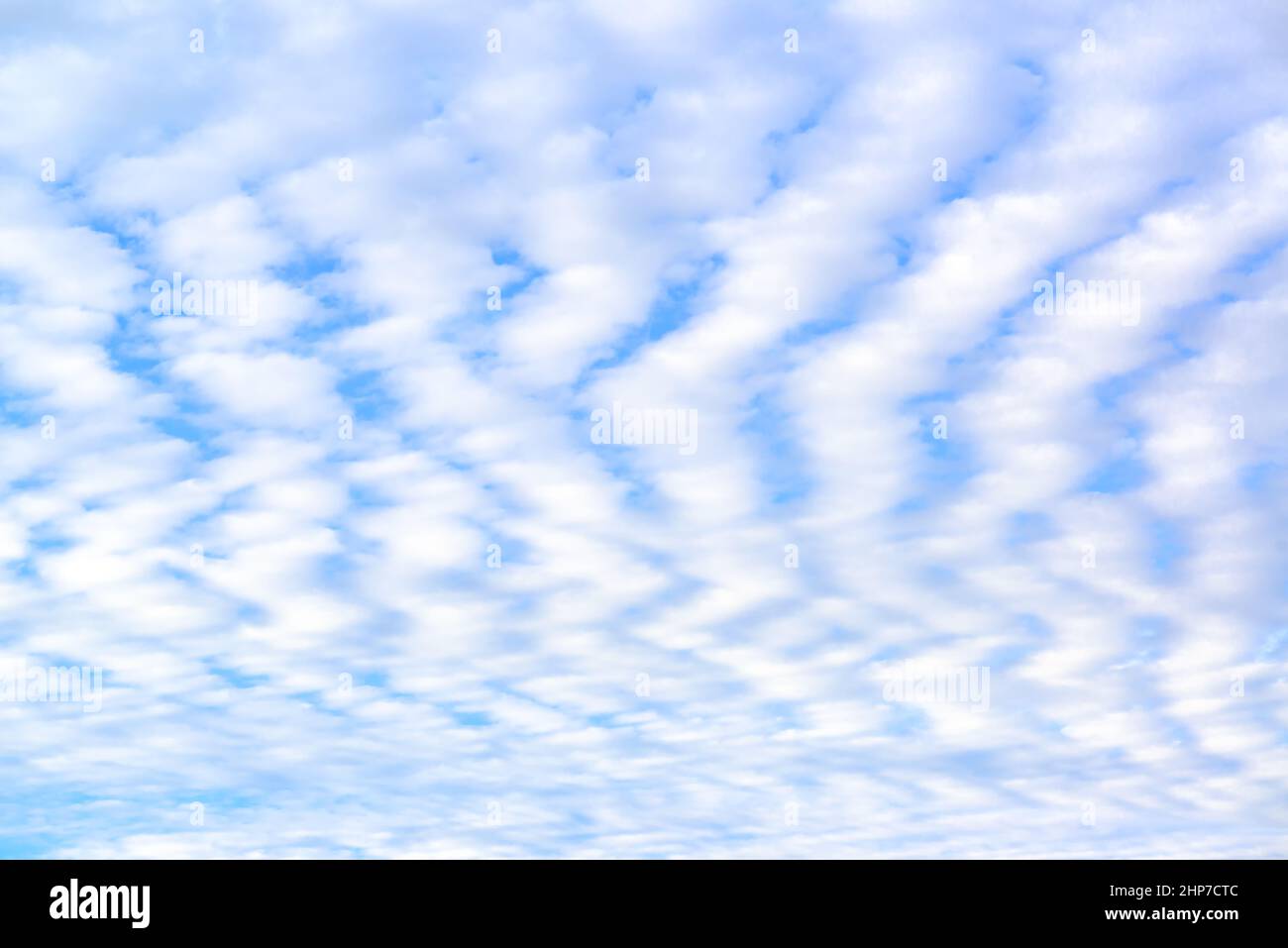 Blue sky and white spindrift cclouds - background, texture, cloudscape pattern Stock Photo