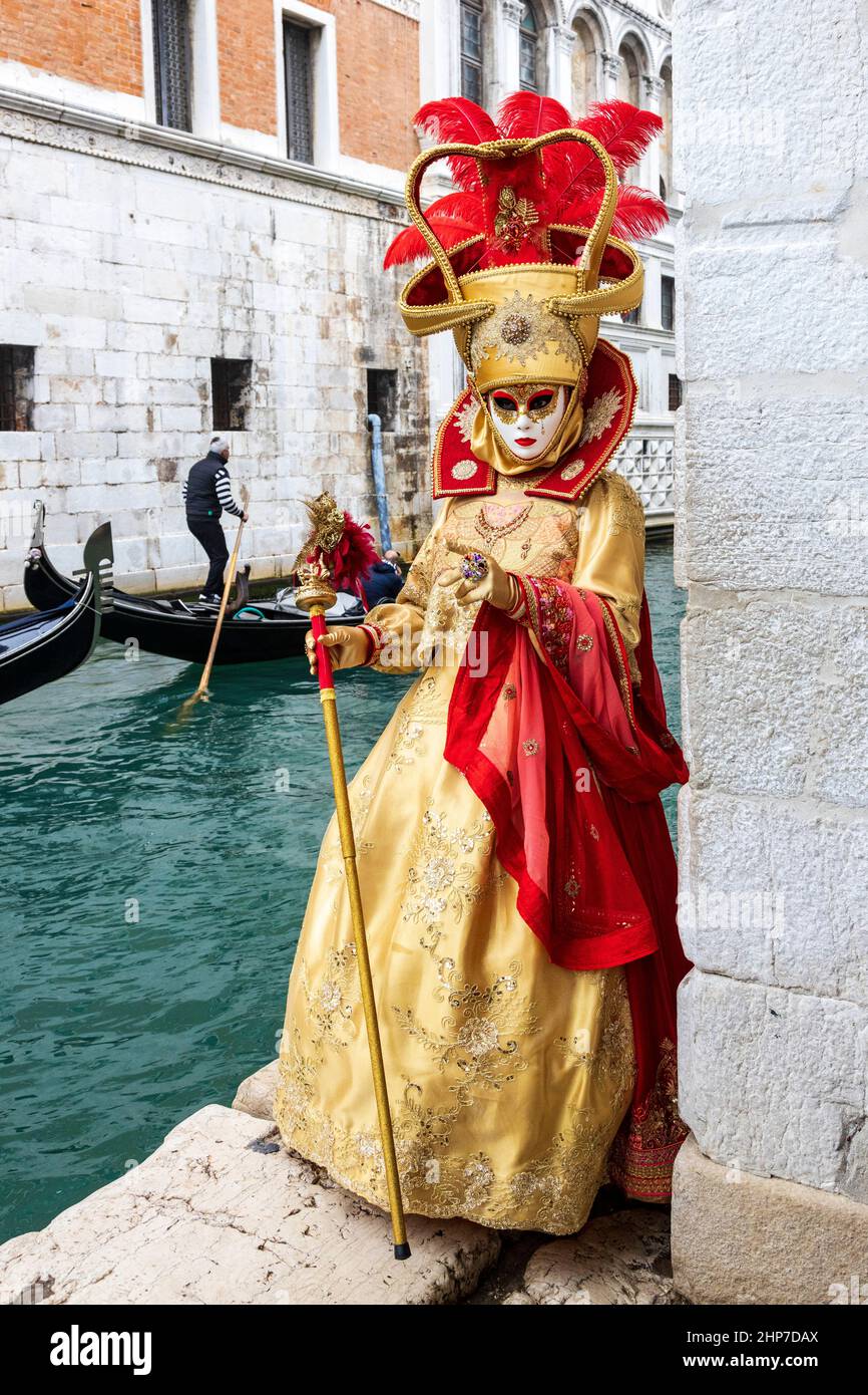 Venice, Italy. 19 February 2022. Despite the ongoing Corona pandemic, the Carnival in Venice attracts many people in  colourful costumes and tourists. Credit: 51North/Alamy Live News Stock Photo