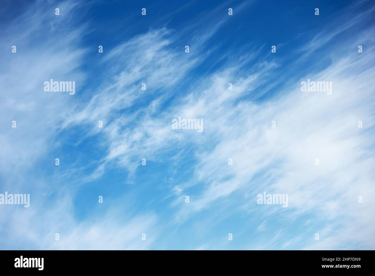 Abstract background with fast moving clouds in the blue sky Stock Photo