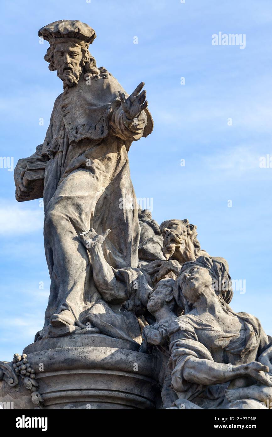 Statue of Ivo of Kermartin by Matthias Braun (1711) on Charles Bridge in Prague, Czech Republic Stock Photo