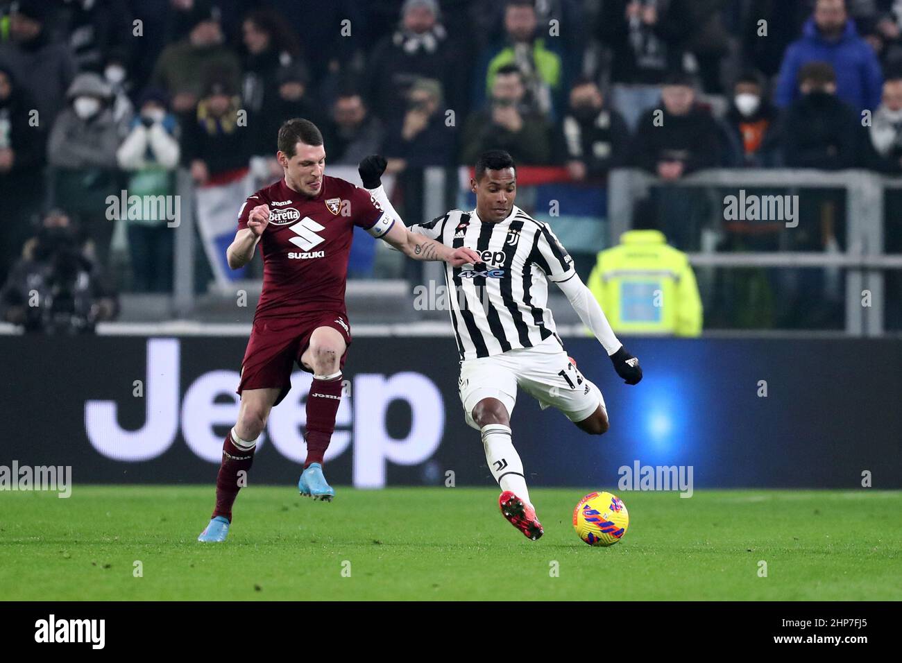 Torino, Italy. 18th Feb, 2022. Alex Sandro of Juventus Fc and Andrea Belotti of Torino Fc battle for the ball during the Serie A match between Juventus Fc and Torino Fc at Allianz Stadium on February 18, 2022 in Turin, Italy. Credit: Marco Canoniero/Alamy Live News Stock Photo