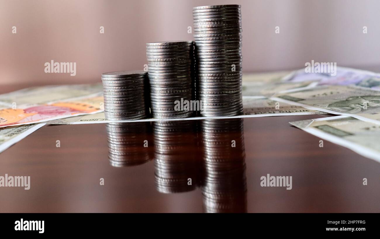 Economic growth,success pillars,Closeup photo of coin,salary growth