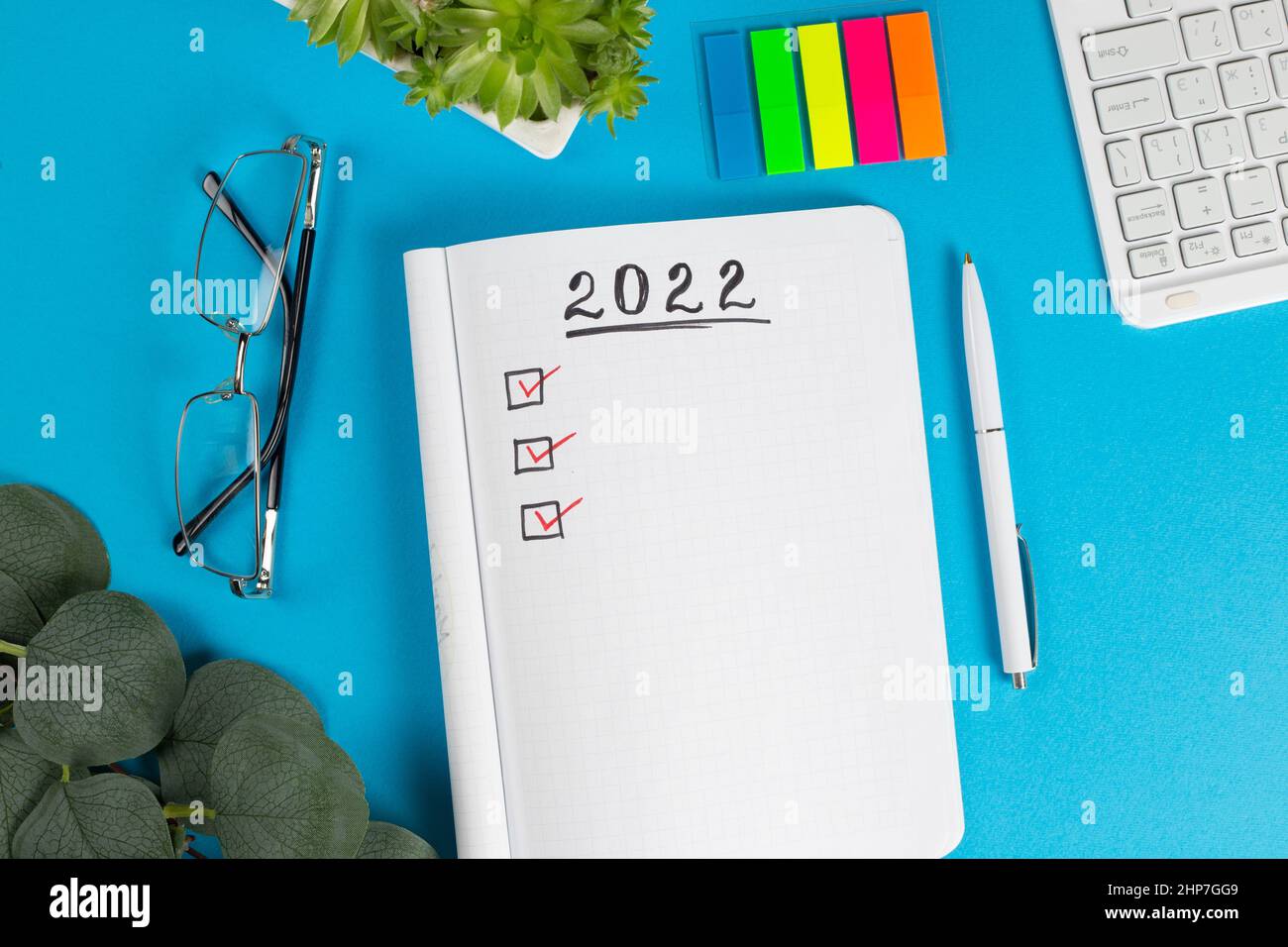 To do list for 2022 in notebook plan. Top view, flat lay, copy space. Stock Photo