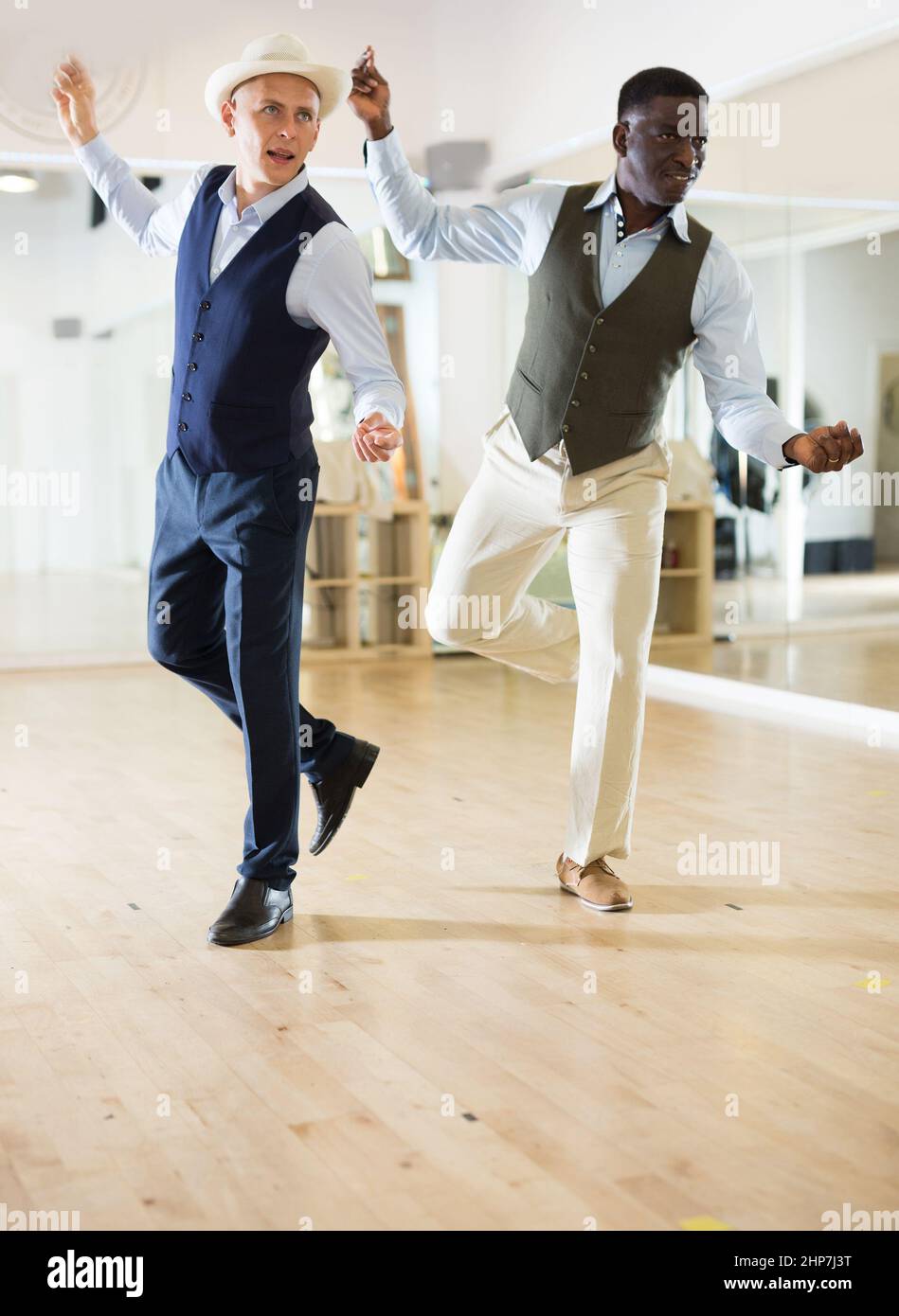 Two professional dancers practicing lindy hop in dance class Stock Photo