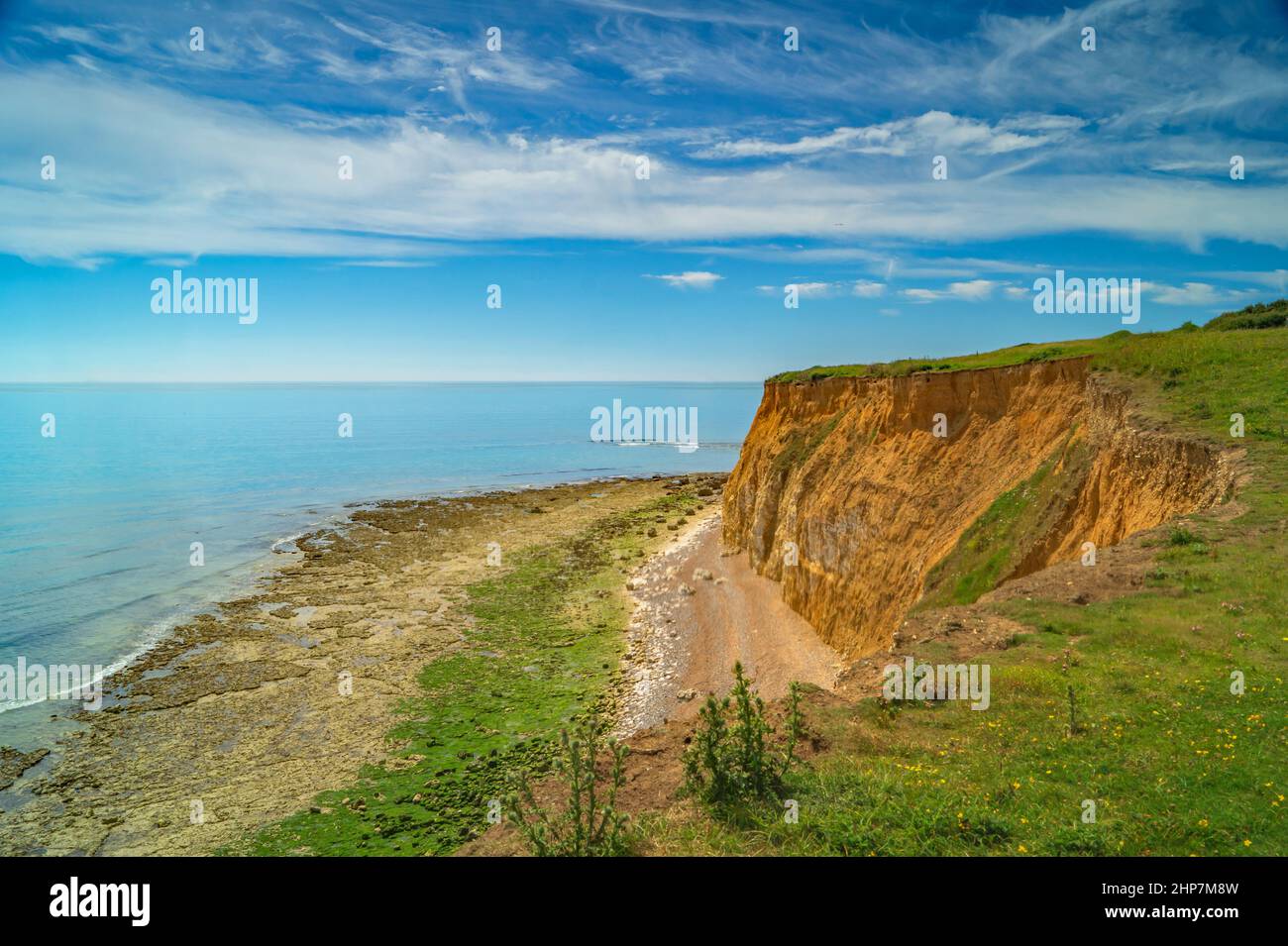 The seashore and cliff face at the Seven Sisters cliffs on a beautiful bright day Stock Photo