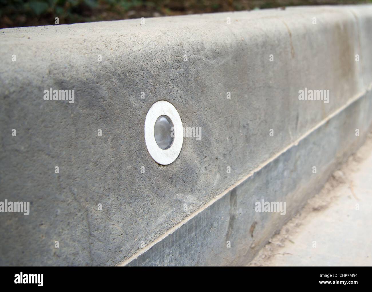 Road curb with integrated illumination lamp Stock Photo