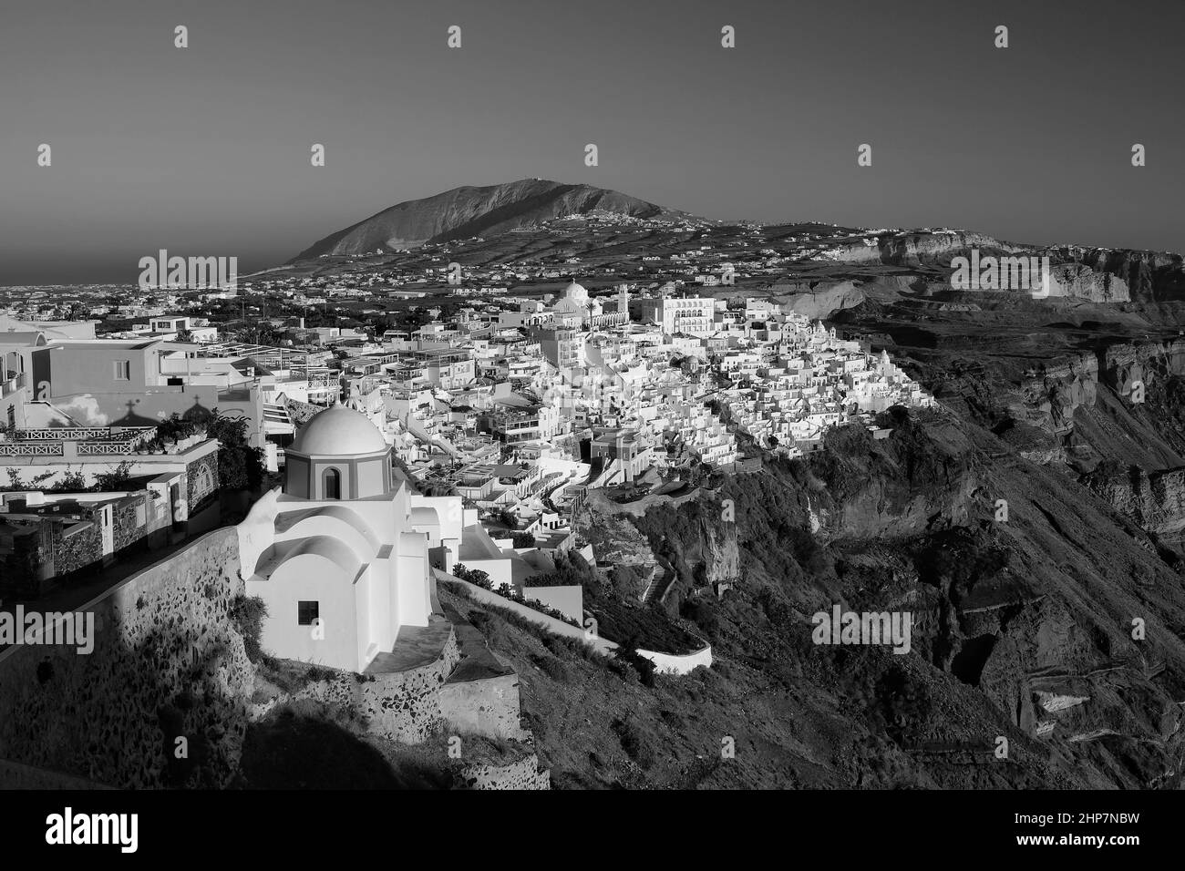 Panoramic view of the picturesque village of Fira Santorini and the Aegean Sea in black and white Stock Photo