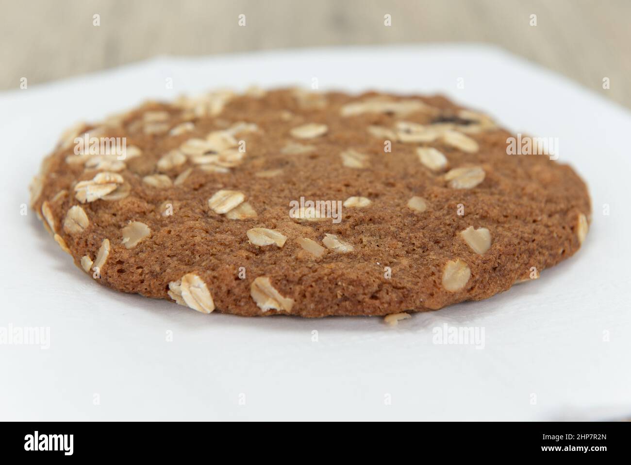 Homemade oatmeal cookie is fresh from the oven and ready to satisfy that sweet appetite. Stock Photo