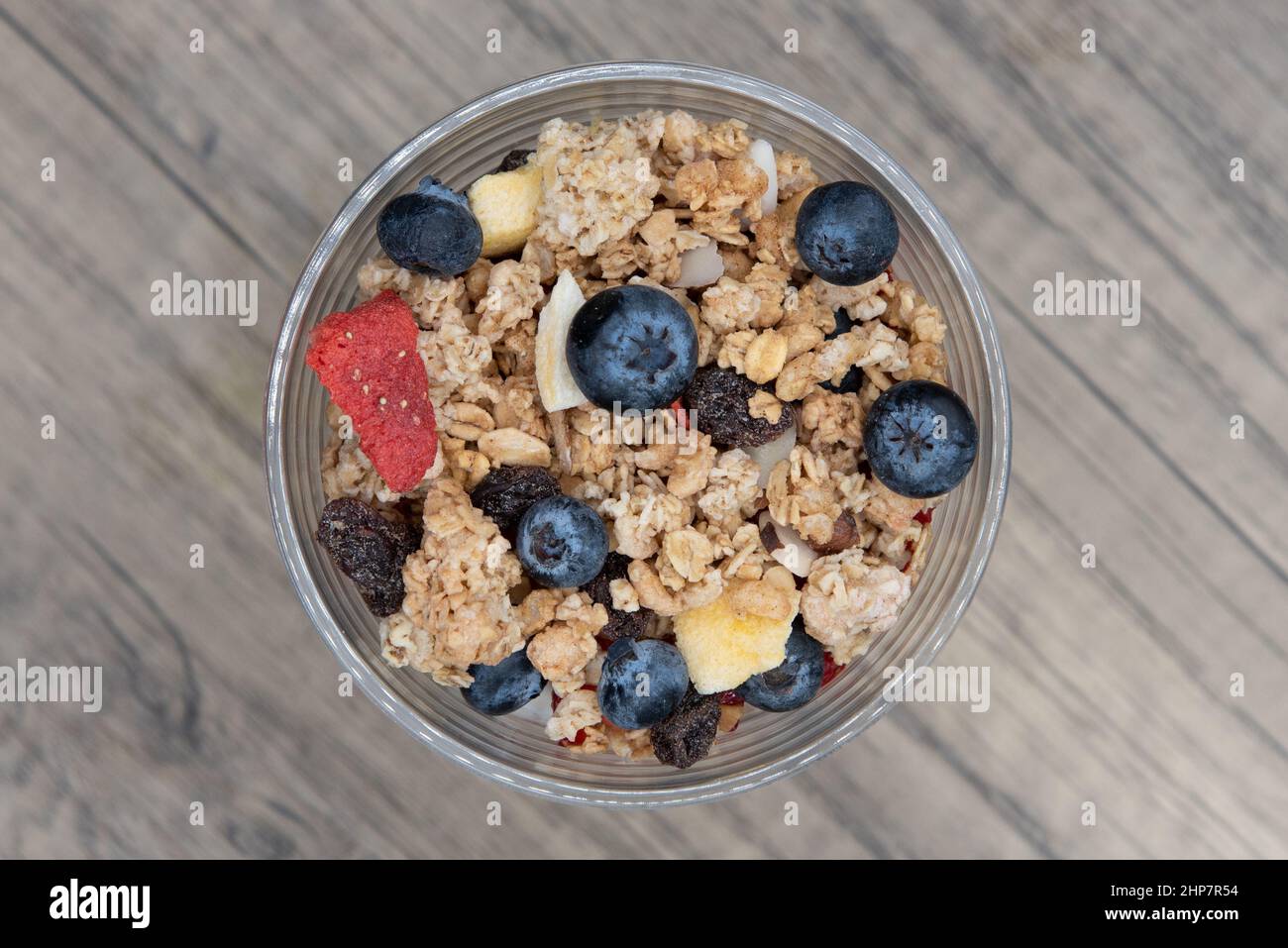 Overhead view of complete meal contained in this cup of yogurt, blueberries, strawberries, and