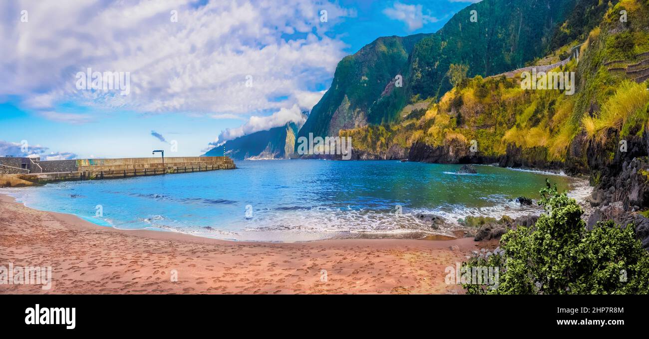 Panorama of the coastline and Cais do Seixal volcanic beach in Madeira island, Portugal Stock Photo