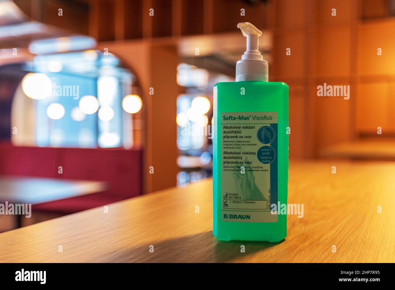 Brno, Czech Republic, January 14. 2021 - Hand disinfection for customers is built on the table in the dining room. The background is blurred by the te Stock Photo