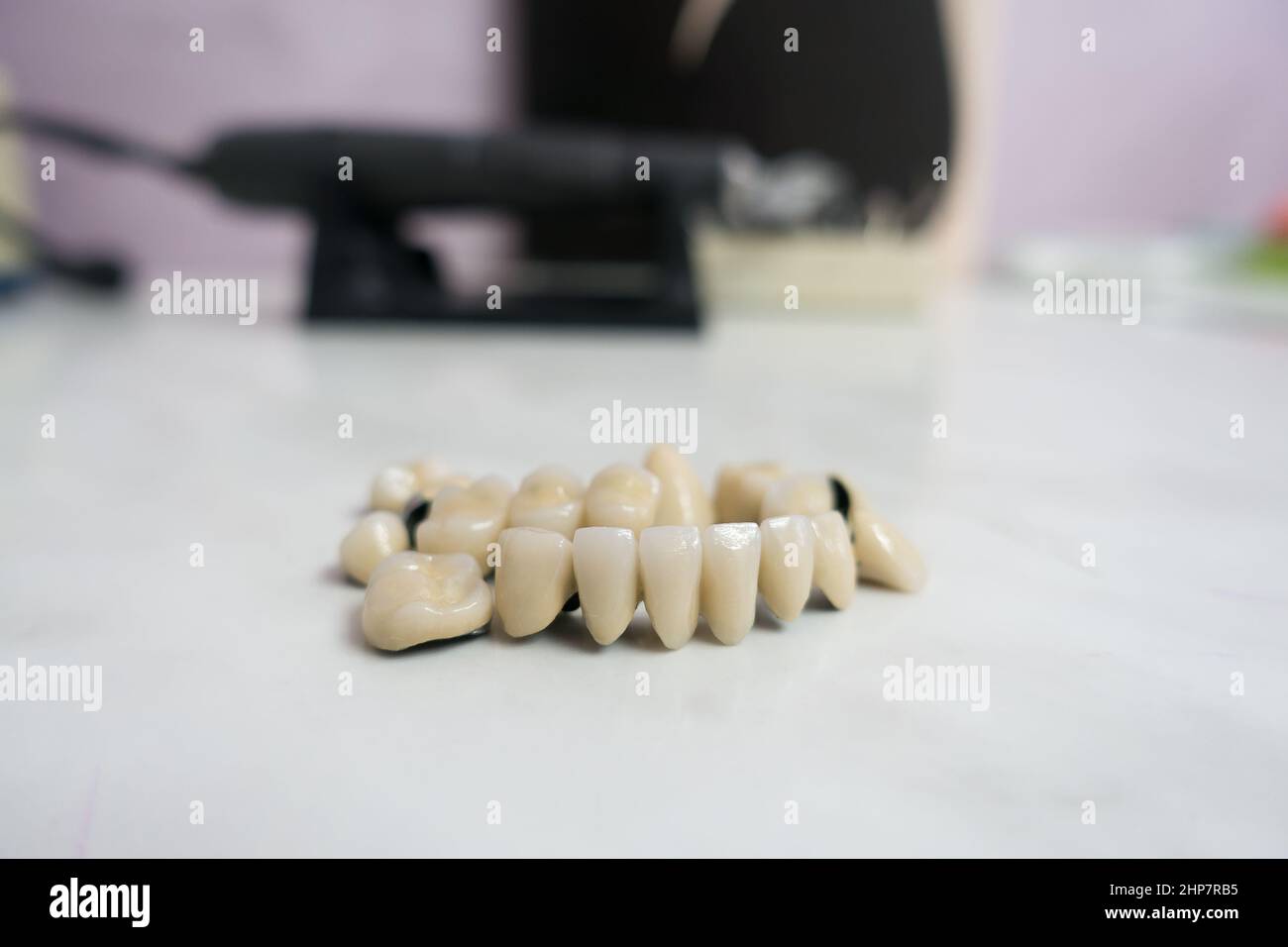 dental ceramic metal bridges are on the table Stock Photo Alamy