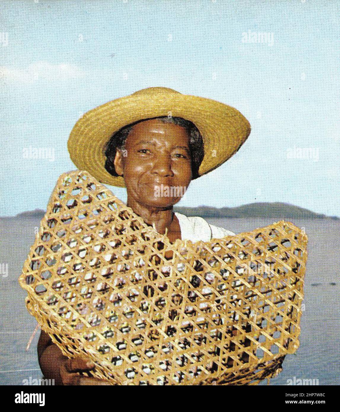 Seychelloise and model fish trap. ca.  early 1970s Stock Photo