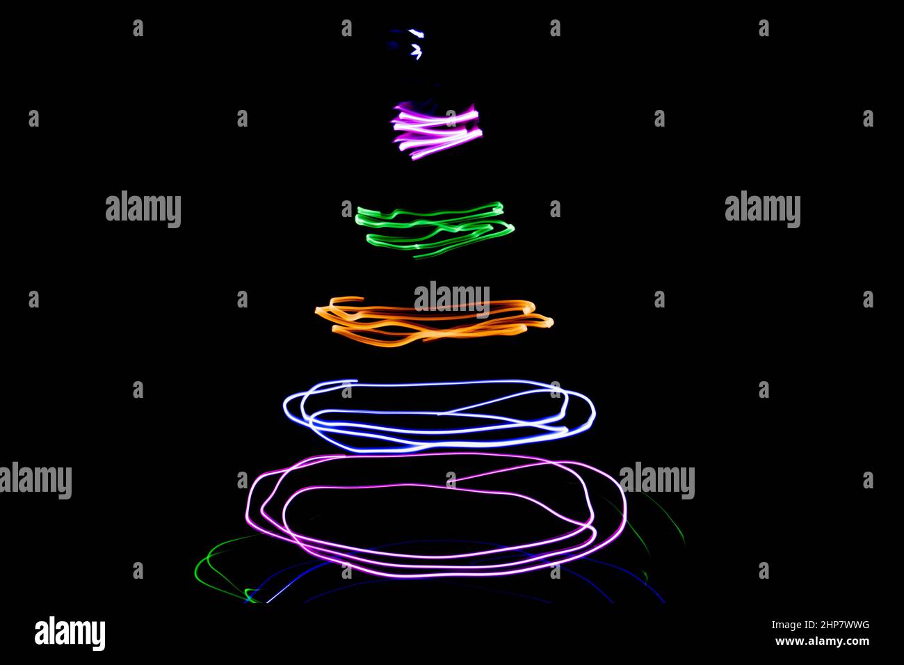 Multicolored circular lights on a black background Stock Photo