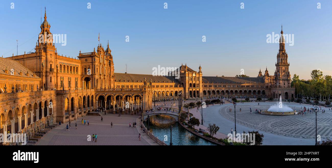 Spanish Square - A panoramic sunset view of Spanish Square, one of most popular tourist attractions in the city, on an Autumn evening. Seville, Spain. Stock Photo