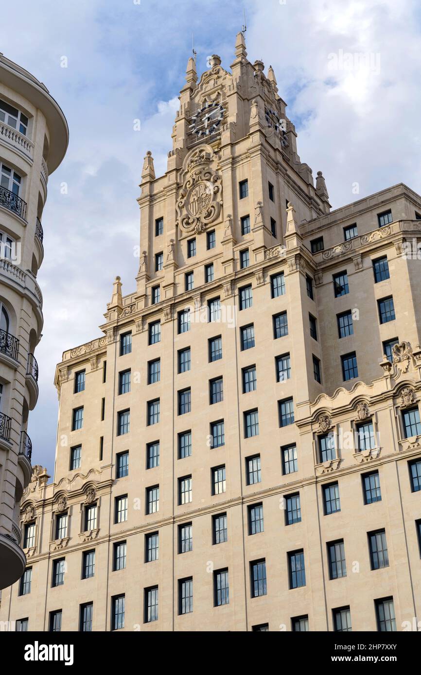Telefónica Building - A low-angle evening view of upper section of Telefónica Building on the busy Gran Via in Central Madrid, Spain. Stock Photo