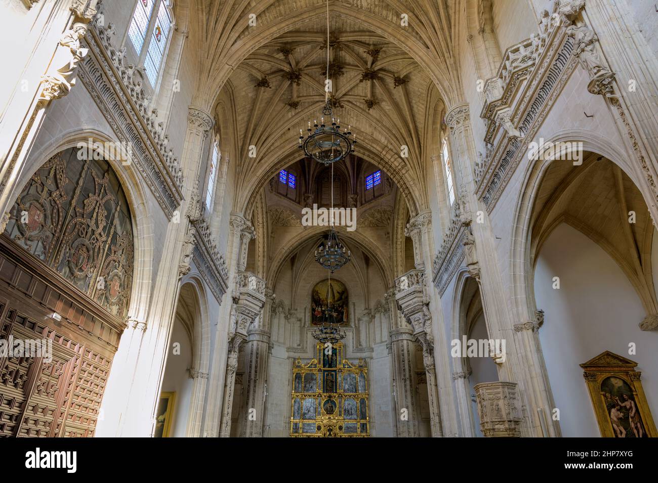 Old Chapel - Wide-angle and low-angle view of bright evening sunlight shining in main chapel of Monastery of San Juan de los Reyes, Toledo, Spain. Stock Photo