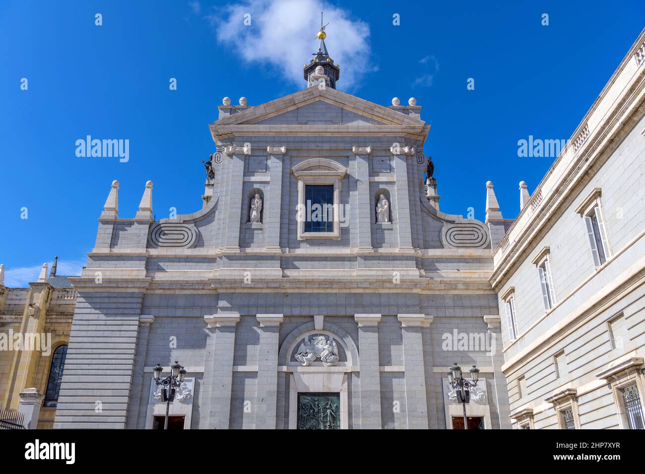 East Entrance of Almudena Cathedral - A sunny Autumn day view of the façade of east entrance of Almudena Cathedral, Madrid, Spain. Stock Photo