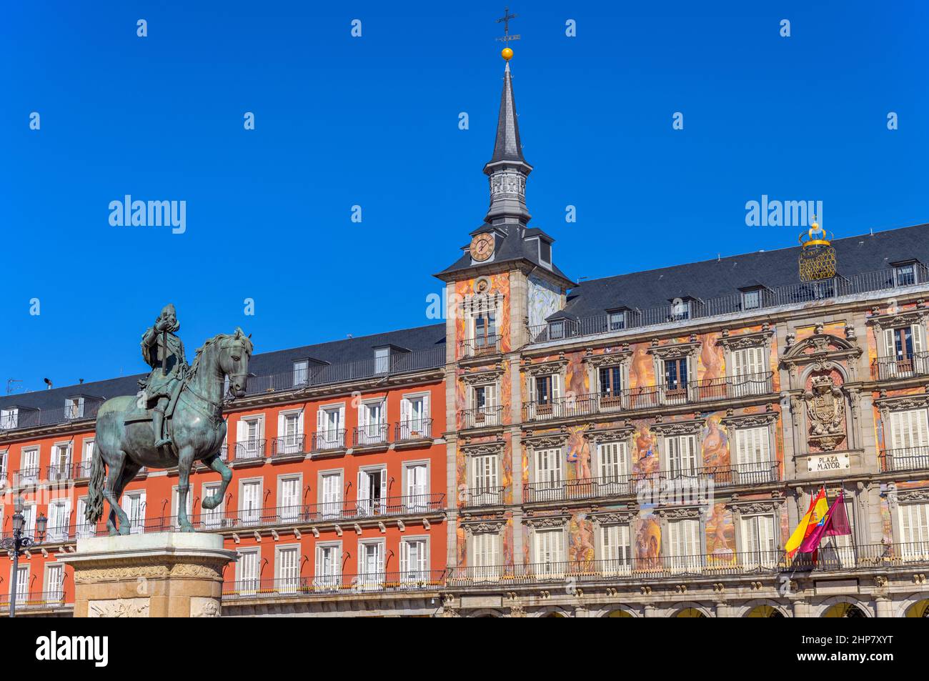 Plaza Mayor - Sunny autumn day view of equestrian statue of Philip III standing at front of one of surrounding buildings of Plaza Mayor. Madrid, Spain. Stock Photo