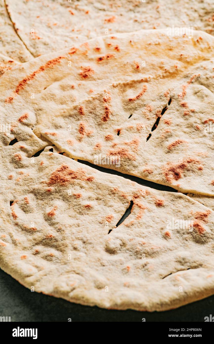 Carta Da Musica, an Italian flabread eaten with cheese and cured meat, also  called pane carasau in Sardinia where it is a specialty Stock Photo - Alamy