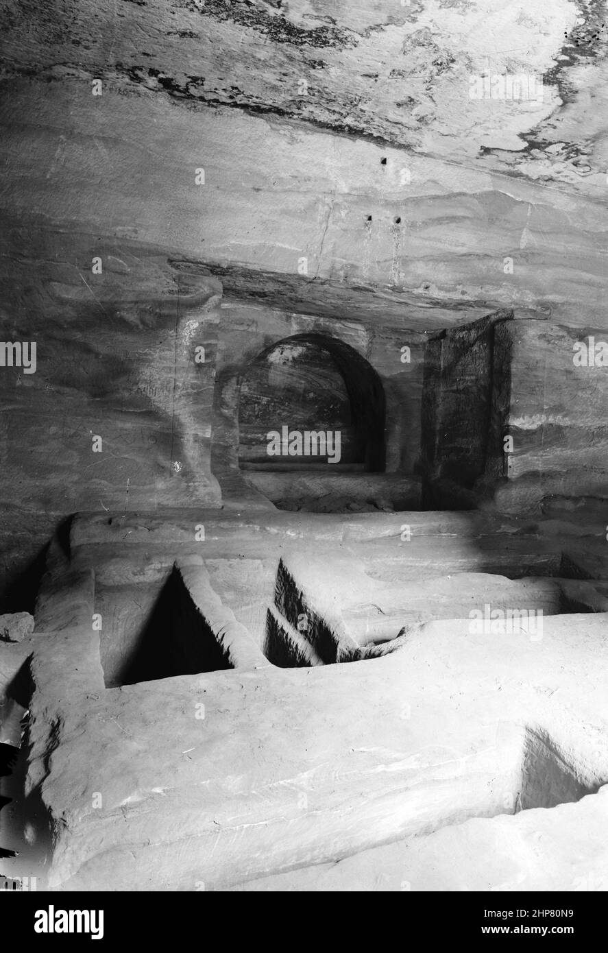 Middle East History: Petra (Wadi Musa). Lower Siq. Tomb interior in lower Siq. Floor graves and loculi  Location:  Jordan--Petra (Extinct city)  ca.  1920 Stock Photo