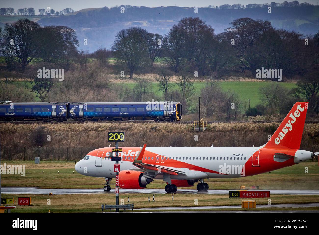 Scotrail class 158 DMU train  and Easyjet  G-UZLA. Airbus A320-251N at Edinburgh Airport Stock Photo