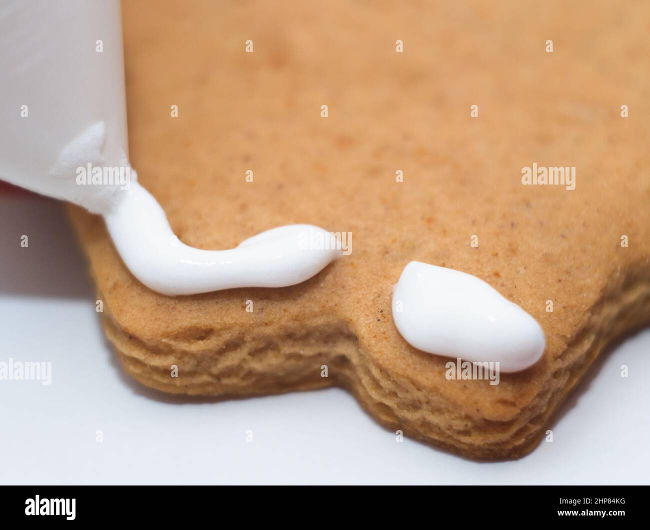 Decorating Gingerbread with Egg White Cream Macro Closeup Stock Photo