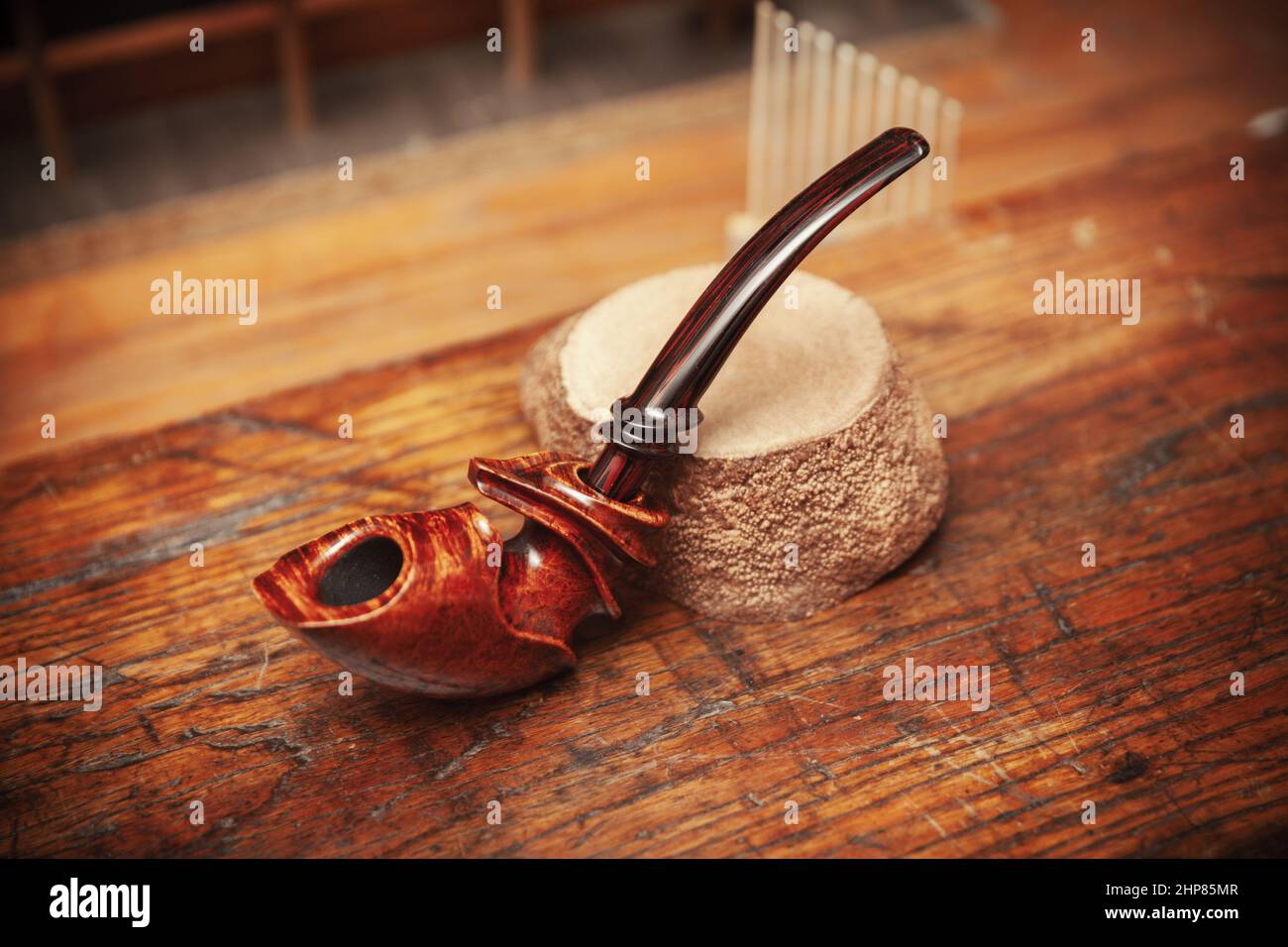 vintage smoking pipe on the leather background, close up Stock Photo