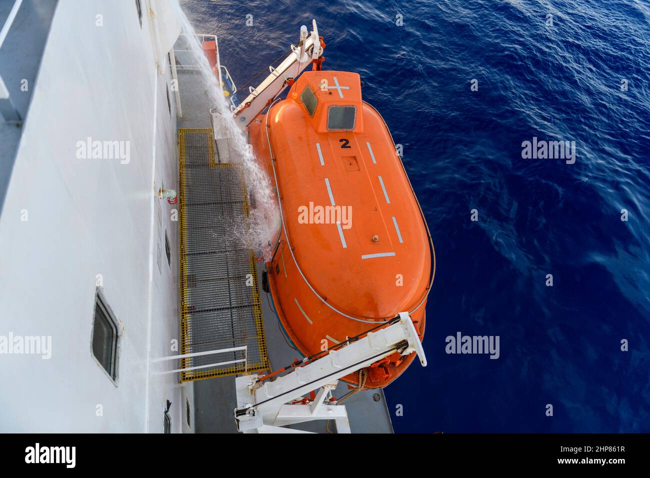 Hose pressure water test of totally enclosed lifeboat. Watertight test