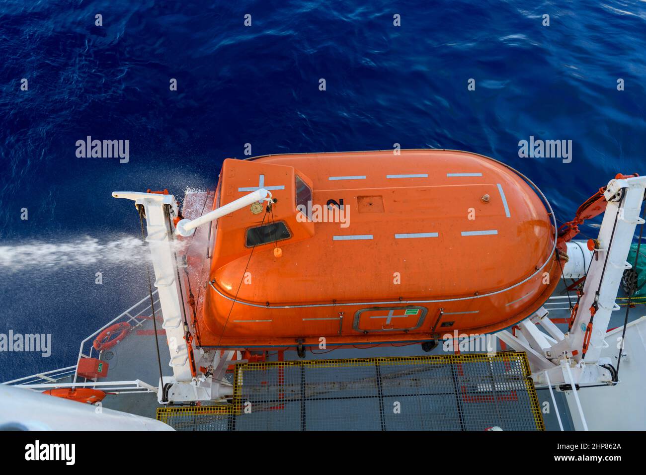 Hose pressure water test of totally enclosed lifeboat. Watertight test