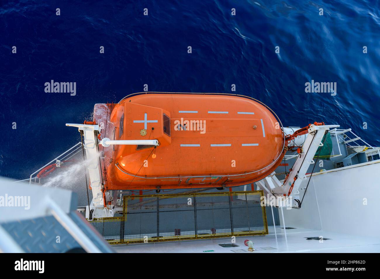 Hose pressure water test of totally enclosed lifeboat. Watertight test