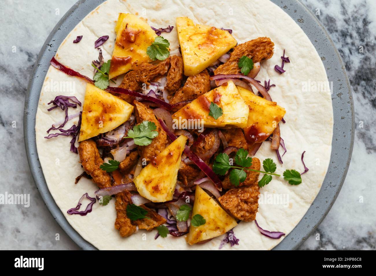 Burritos with Spicy TVP Curls, Cabbage Slaw and Fresh Pineapple Stock Photo