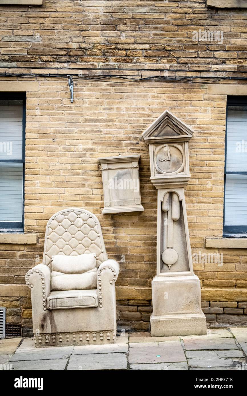 Grandad's Clock and Chair, sculpture by Timothy Shutter, in Chapel Street, Little Germany, Bradford, West Yorkshire, England, UK. Stock Photo